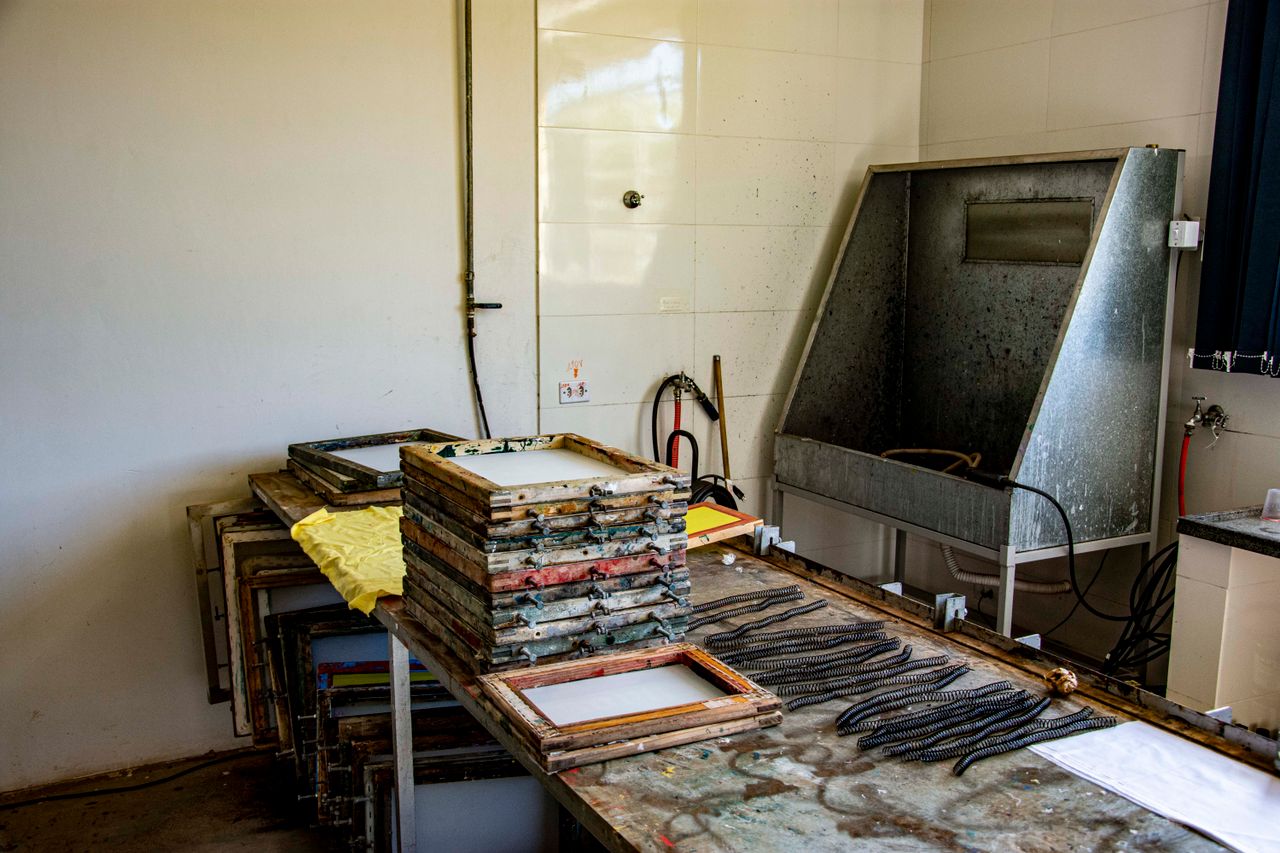 Stacked papermaking frames in an educational workshop in Apucarana, Brazil.